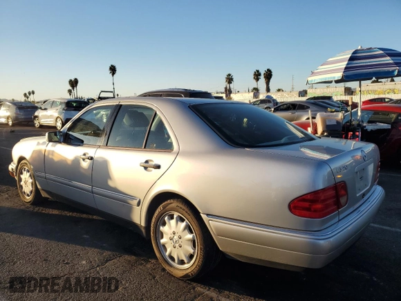 1999 Mercedes-Benz E 320 with VIN WDBJF65H8XA734585, listed as a Copart auction lot 79141194 with 196,908 mi miles and Salvage Title. Bid and sale history available at DreamBid. Image 2.