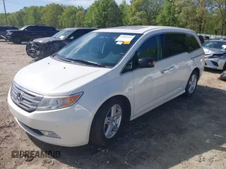 2013 Honda Odyssey Touring with VIN 5FNRL5H96DB009694, listed as a IAAI auction lot 42002487 with 182,867 mi miles and . Bid and sale history available at carsss.com. Image 2.