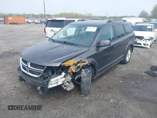 2017 Dodge Journey SXT with VIN 3C4PDDBG5HT618563, listed as a IAAI auction lot 42015188 with 104,747 mi miles and . Bid and sale history available at DreamBid. Image 2.