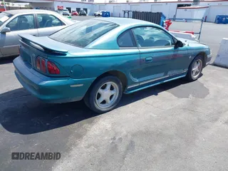 1997 Ford Mustang with VIN 1FALP4049VF200422, listed as a IAAI auction lot 42073947 with 157,937 mi miles. Bid and sale history available at carsss.com. Image 4.