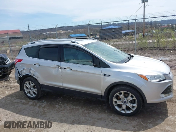 2016 Ford Escape Titanium with VIN 1FMCU9JX3GUA62802, listed as a IAAI auction lot 42001690 with 124,452 mi miles. Bid and sale history available at carsss.com. Image 13.
