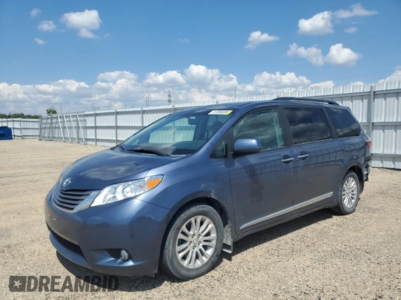 2015 Toyota Sienna XLE with VIN 5TDYK3DC4FS619385, listed as a Copart auction lot 57090385 with 112,896 mi miles and Salvage title. Bid and sale history available at DreamBid. Image 1.