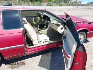 2002 Cadillac Eldorado ESC z VIN 1G6EL12Y72B102153, wystawiony jako IAAI lot #41861541 z przebiegiem 91 273 mil mil oraz . Historia ofert i sprzedaży dostępna na DreamBid. Obrazek 5.