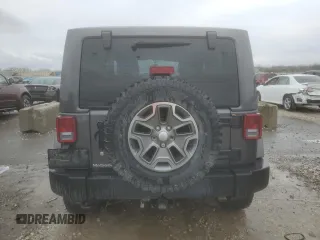2014 Jeep Wrangler Rubicon with VIN 1C4BJWCG9EL189819, listed as a Copart auction lot 80522204 with 82,083 mi miles and Salvage title. Bid and sale history available at DreamBid. Image 6.