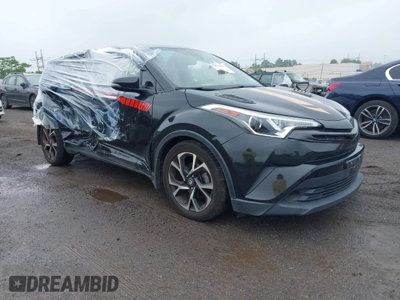 2018 Toyota C-HR XLE with VIN JTNKHMBX6J1000904, listed as a IAAI auction lot 42513117 with 77,192 mi miles and . Bid and sale history available at DreamBid. Image 1.