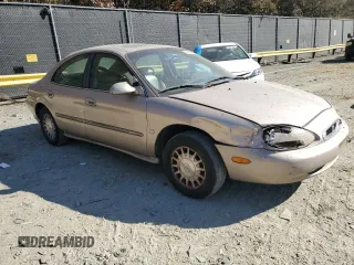 1999 Mercury Sable LS z VIN 1MEFM53S7XG602788, wystawiony jako Copart lot #76894294 z przebiegiem 186 315 mil mil oraz Szkody całkowita. Historia ofert i sprzedaży dostępna na DreamBid. Obrazek 4.