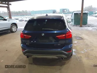 2019 BMW X1 xDrive28i with VIN WBXHT3C55K5L37338, listed as a IAAI auction lot 41934461 with 87,913 mi miles. Bid and sale history available at carsss.com. Image 16.