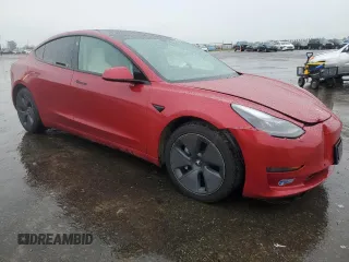 2021 Tesla Model 3 Standard Range Plus with VIN 5YJ3E1EA9MF870214, listed as a Copart auction lot 47702535 with 46,486 mi miles and Salvage Title. Bid and sale history available at DreamBid. Image 4.