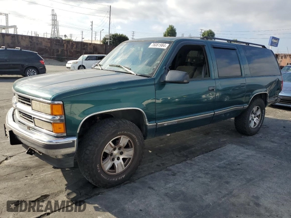 1997 Chevrolet Suburban with VIN 3GNFK16R4VG163602, listed as a Copart auction lot 76081984 with 243,169 mi miles and Salvage Title. Bid and sale history available at carsss.com. Image 1.