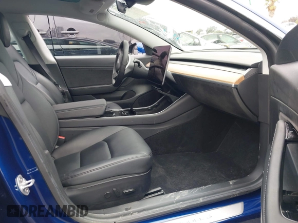 2020 Tesla Model 3 Standard Range Plus with VIN 5YJ3E1EAXLF644679, listed as a IAAI auction lot 41500595 with 53,726 mi miles and . Bid and sale history available at DreamBid. Image 5.