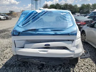 2018 Ford Escape S with VIN 1FMCU0F76JUD06292, listed as a Copart auction lot 56584245 with 136,973 mi miles and Salvage title. Bid and sale history available at DreamBid. Image 6.