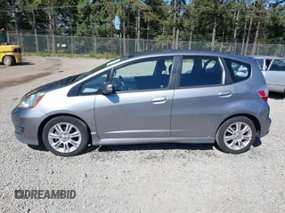 2009 Honda Fit Sport z VIN JHMGE88489S001452, wystawiony jako IAAI lot #42316783 z przebiegiem 129 856 mil mil oraz . Historia ofert i sprzedaży dostępna na DreamBid. Obrazek 14.