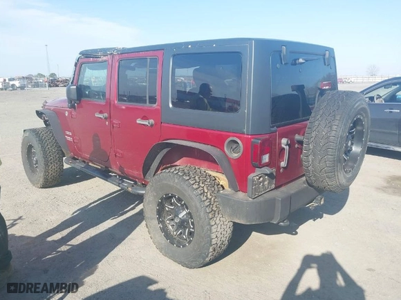 2012 Jeep Wrangler Unlimited Sport with VIN 1C4BJWDGXCL163905, listed as a IAAI auction lot 41784769 with 142,954 mi miles. Bid and sale history available at carsss.com. Image 3.
