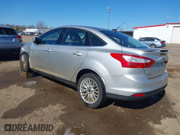 2014 Ford Focus Titanium with VIN 1FADP3J28EL354505, listed as a IAAI auction lot 42025966 with 104,868 mi miles. Bid and sale history available at carsss.com. Image 3.