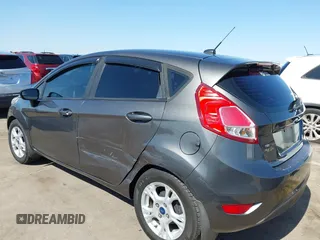 2015 Ford Fiesta SE z VIN 3FADP4EJ0FM146237, wystawiony jako IAAI lot #42452345 z przebiegiem 121 742 mil mil oraz . Historia ofert i sprzedaży dostępna na DreamBid. Obrazek 6.