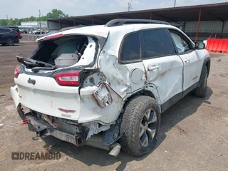 2017 Jeep Cherokee Trailhawk with VIN 1C4PJMBSXHW657446, listed as a IAAI auction lot 42406437 with 158,351 mi miles and . Bid and sale history available at DreamBid. Image 4.