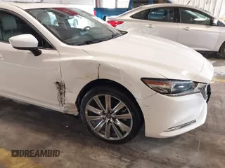 2021 Mazda 6 Carbon Edition with VIN JM1GL1WY9M1614117, listed as a IAAI auction lot 41305576 with 54,670 mi miles and . Bid and sale history available at DreamBid. Image 17.