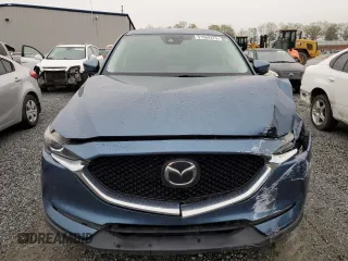 2017 Mazda CX-5 Touring with VIN JM3KFBCLXH0124451, listed as a Copart auction lot 51060275 with 126,807 mi miles and Salvage Title. Bid and sale history available at carsss.com. Image 5.