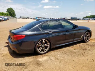 2018 BMW 5 Series M550i xDrive with VIN WBAJB9C54JB286450, listed as a Copart auction lot 61232125 with 88,479 mi miles and Salvage title. Bid and sale history available at DreamBid. Image 3.
