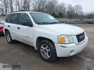 2004 GMC Envoy SLE with VIN 1GKDT13SX42357048, listed as a IAAI auction lot 41601126 with 304,101 mi miles. Bid and sale history available at carsss.com. Image 1.