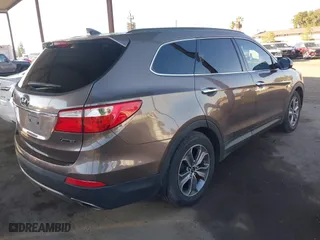 2014 Hyundai Santa Fe Limited with VIN KM8SN4HFXEU069526, listed as a IAAI auction lot 40768034 with 186,650 mi miles. Bid and sale history available at carsss.com. Image 4.