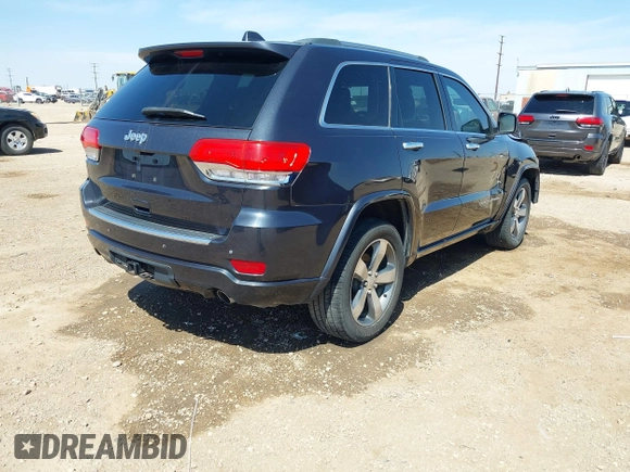 2015 Jeep Grand Cherokee Overland with VIN 1C4RJECG3FC635327, listed as a IAAI auction lot 41910559 with 118,519 mi miles and . Bid and sale history available at DreamBid. Image 4.