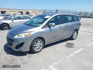 2012 Mazda Mazda5 Sport with VIN JM1CW2BL4C0103408, listed as a IAAI auction lot 42087883 with 219,601 mi miles. Bid and sale history available at carsss.com. Image 2.