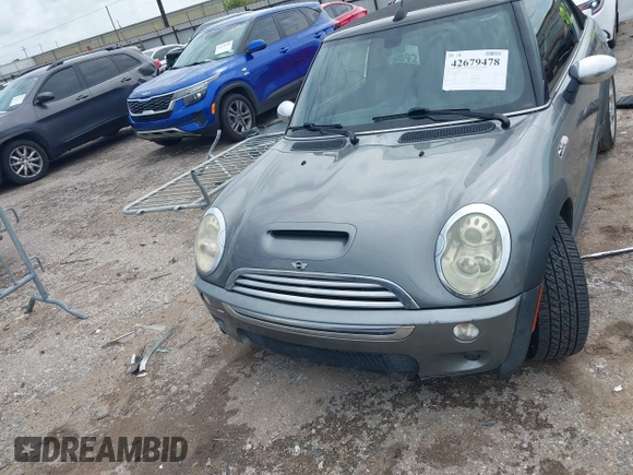 2006 MINI Convertible S with VIN WMWRH33586TF87791, listed as a IAAI auction lot 42679478 with 90,209 mi miles and . Bid and sale history available at DreamBid. Image 6.