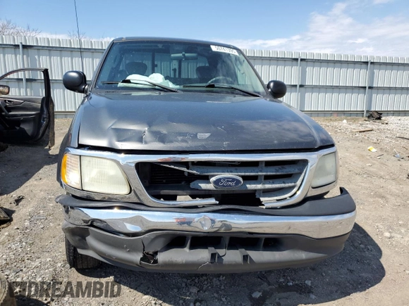 2003 Ford F-150 XL with VIN 1FTRX17L43NA66874, listed as a Copart auction lot 50741395 with 196,161 mi miles and Salvage title. Bid and sale history available at DreamBid. Image 5.