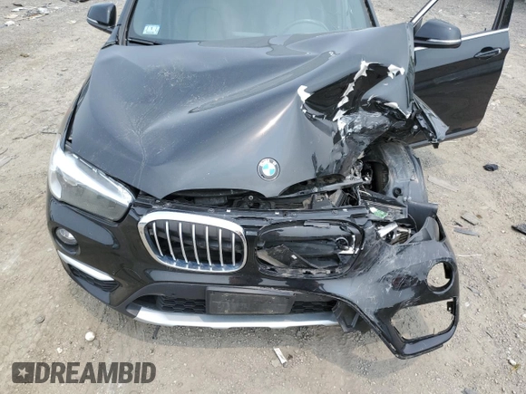 2018 BMW X1 xDrive28i with VIN WBXHT3C36J3H29952, listed as a Copart auction lot 59679285 with 75,220 mi miles and Salvage title. Bid and sale history available at DreamBid. Image 12.