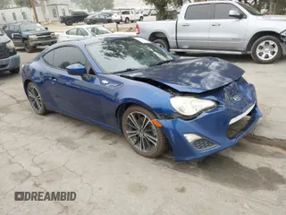 2013 Scion FR-S with VIN JF1ZNAA17D2702726, listed as a IAAI auction lot 42007734 with 124,177 mi miles. Bid and sale history available at carsss.com. Image 1.