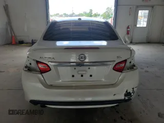 2016 Nissan Altima SR z VIN 1N4AL3AP7GC199555, wystawiony jako Copart lot #57250315 z przebiegiem 210 826 mil mil oraz Szkoda całkowita • Salvage title. Historia ofert i sprzedaży dostępna na DreamBid. Obrazek 6.