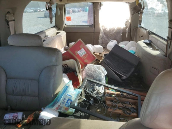 1997 GMC Suburban z VIN 3GKFK16R7VG514905, wystawiony jako Copart lot #77410934 z przebiegiem 193 116 mil mil oraz Szkoda całkowita • Salvage title. Historia ofert i sprzedaży dostępna na DreamBid. Obrazek 10.