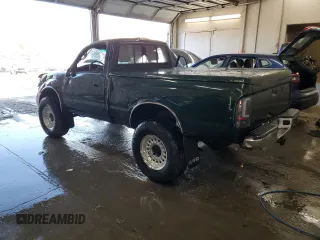 1999 Toyota Tacoma with VIN 4TAPM62N9XZ555738, listed as a Copart auction lot 78293634 with 210,096 mi miles and Salvage Title. Bid and sale history available at DreamBid. Image 2.