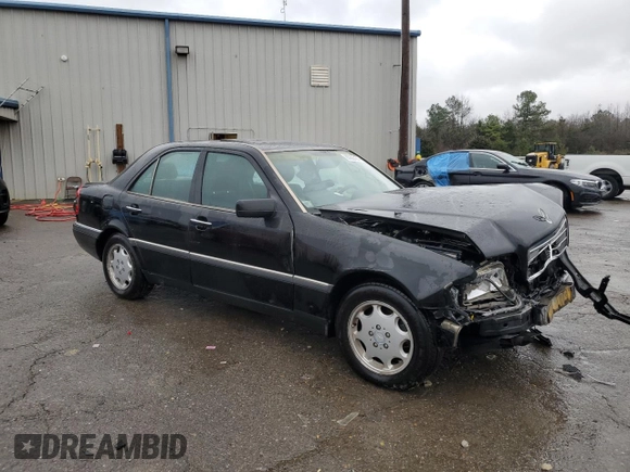1996 Mercedes-Benz C with VIN WDBHA28E7TF328169, listed as a Copart auction lot 83653124 with 282,232 mi miles and Salvage Title. Bid and sale history available at carsss.com. Image 4.