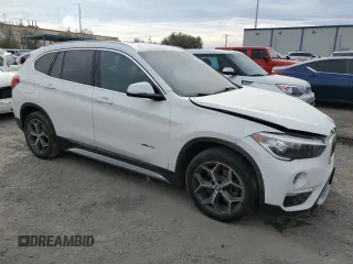 2018 BMW X1 sDrive28i with VIN WBXHU7C37J5H44386, listed as a Copart auction lot 42167135 with 96,668 mi miles and Salvage Title. Bid and sale history available at DreamBid. Image 4.