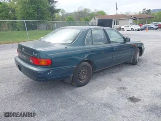 1996 Toyota Camry DX with VIN 4T1BG12K3TU829839, listed as a IAAI auction lot 42085170 with 266,741 mi miles. Bid and sale history available at carsss.com. Image 4.