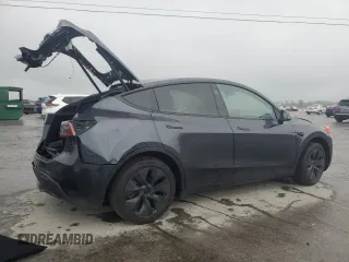 2024 Tesla Model Y with VIN 7SAYGDED1RA321691, listed as a Copart auction lot 52153945 with 7,544 mi miles and Salvage Title. Bid and sale history available at DreamBid. Image 3.