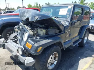 2001 Jeep Wrangler Sahara with VIN 1J4FA59SX1P337951, listed as a IAAI auction lot 42087134 with 154,479 mi miles and . Bid and sale history available at carsss.com. Image 14.
