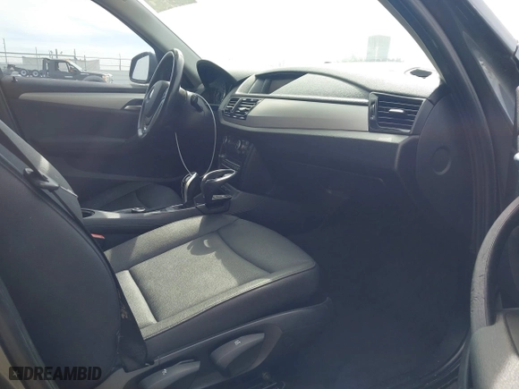 2013 BMW X1 28i with VIN WBAVM1C55DVW41609, listed as a IAAI auction lot 41604038 with 126,036 mi miles. Bid and sale history available at carsss.com. Image 5.