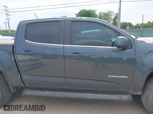 2019 GMC Canyon 4WD SLE z VIN 1GTG6CENXK1261278, wystawiony jako IAAI lot #42064295 z przebiegiem 51 786 mil mil oraz . Historia ofert i sprzedaży dostępna na DreamBid. Obrazek 13.