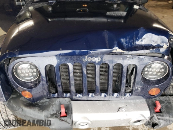 2013 Jeep Wrangler Sahara z VIN 1C4AJWBG4DL504800, wystawiony jako Copart lot #60504575 z przebiegiem 166 687 mil mil oraz Szkoda całkowita • Salvage title. Historia ofert i sprzedaży dostępna na DreamBid. Obrazek 12.