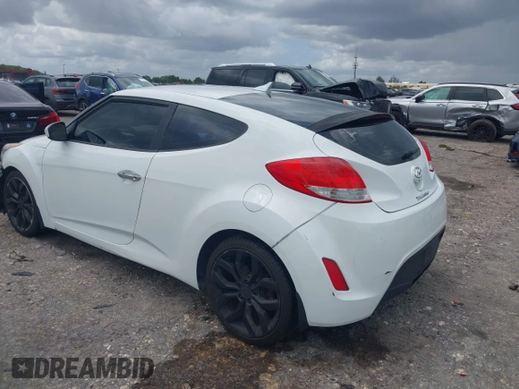 2015 Hyundai Veloster z VIN KMHTC6AD7FU222377, wystawiony jako IAAI lot #42000787 z przebiegiem 150 582 mil mil oraz . Historia ofert i sprzedaży dostępna na DreamBid. Obrazek 3.