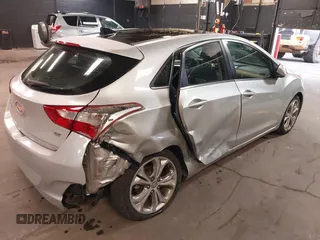 2013 Hyundai Elantra GT with VIN KMHD35LE2DU105677, listed as a IAAI auction lot 42027623 with 137,063 mi miles. Bid and sale history available at carsss.com. Image 4.