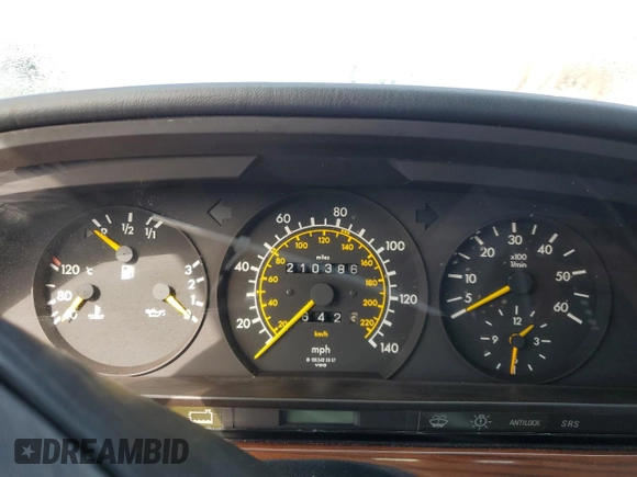 1986 Mercedes-Benz 300 with VIN WDBCB25D9GA279756, listed as a Copart auction lot 46860345 with 210,386 mi miles and Salvage Title. Bid and sale history available at carsss.com. Image 9.