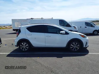 2018 Toyota Prius One with VIN JTDKDTB32J1599890, listed as a IAAI auction lot 42009820 with 57,959 mi miles and . Bid and sale history available at DreamBid. Image 13.