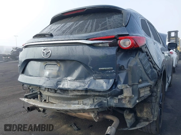 2021 Mazda CX-9 Grand Touring with VIN JM3TCADY1M0519288, listed as a IAAI auction lot 41186094 with 50,701 mi miles and . Bid and sale history available at DreamBid. Image 6.