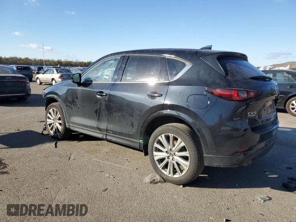 2023 Mazda CX-5 Signature with VIN JM3KFBXYXP0130139, listed as a Copart auction lot 88321445 with 22,911 mi miles and Salvage Title. Bid and sale history available at carsss.com. Image 2.