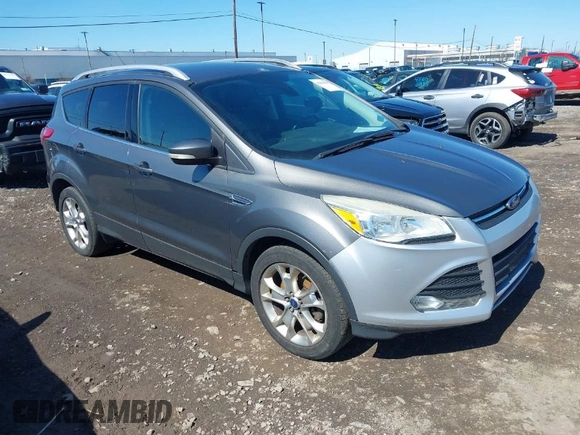 2014 Ford Escape Titanium with VIN 1FMCU9JX1EUB94776, listed as a IAAI auction lot 42063678 with 138,036 mi miles. Bid and sale history available at carsss.com. Image 1.