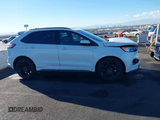 2020 Ford Edge SEL z VIN 2FMPK3J92LBB53467, wystawiony jako IAAI lot #41241115 z przebiegiem 58 183 mil mil oraz . Historia ofert i sprzedaży dostępna na DreamBid. Obrazek 13.